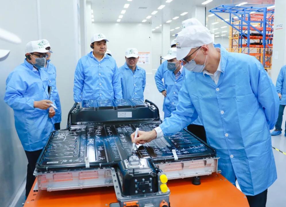 Factory team inspecting a battery pack